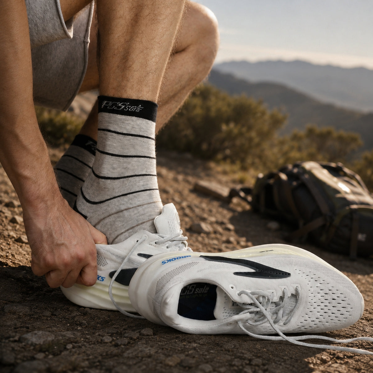 A person outdoors wearing PCSsole cushioned athletic crew socks